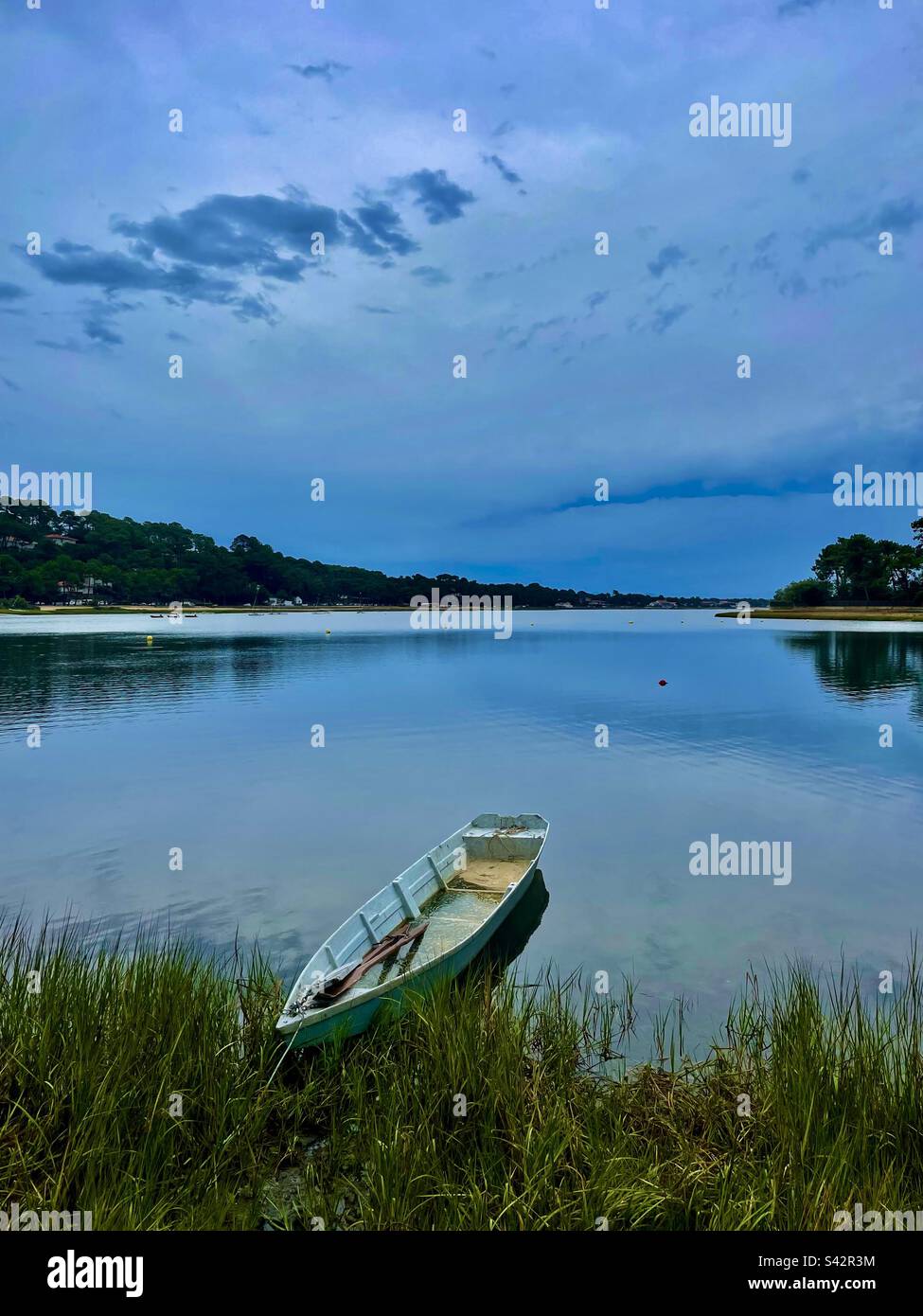 Skiff on a calm lake, south west of France. Romantic, - Smartphone Captured Stock Image