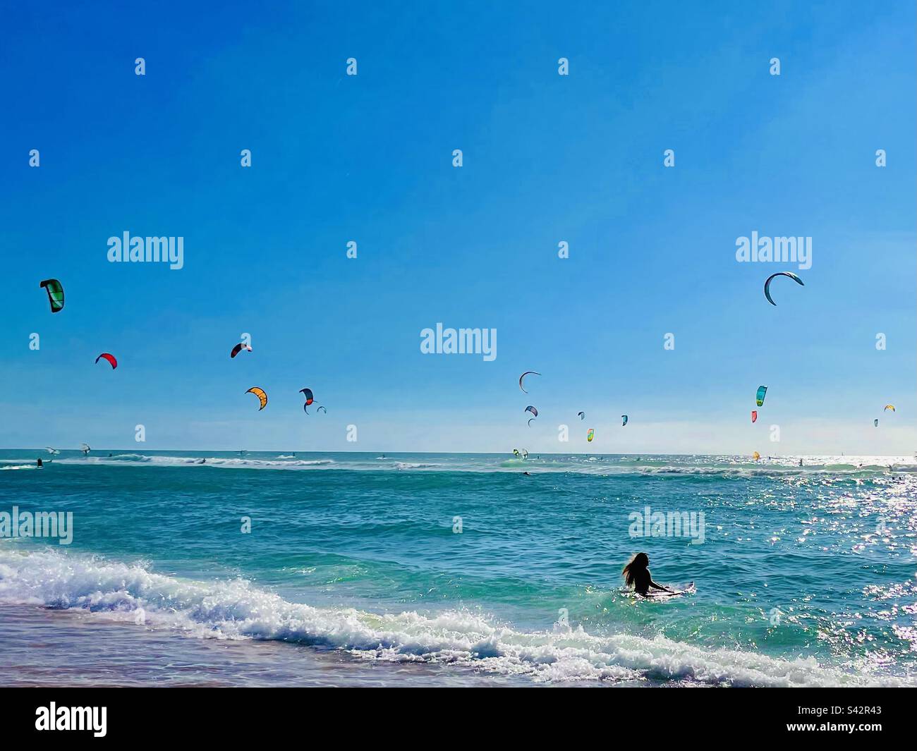 Kite Surfing Session on the Atlantic coast and a surfing mermaid Stock Photo