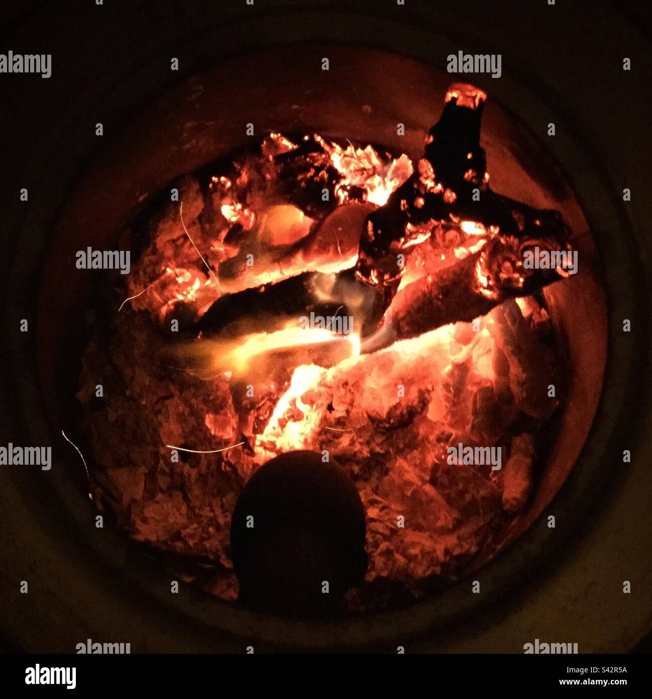 Wood burning stove, Catalonia, Spain. - Smartphone Captured Stock Image