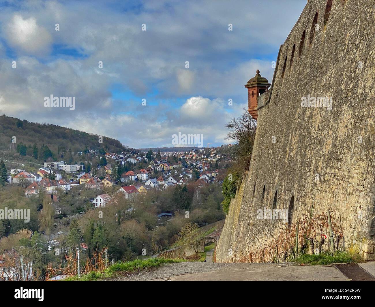 View at houses and hills with Marienberg fortress wall in Würzburg, Germany. - Smartphone Captured Stock Image