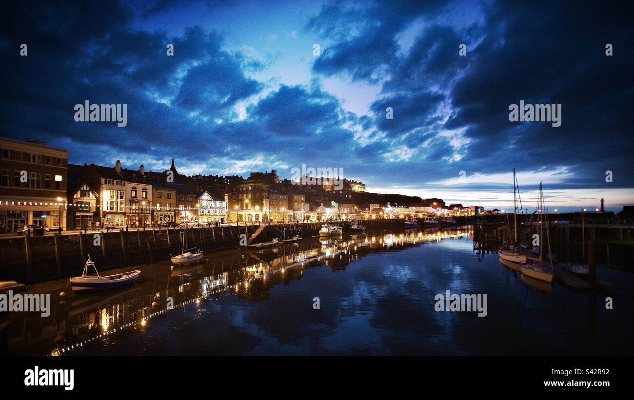 Whitby harbour at night, North Yorkshire, England, United Kingdom Stock Photo