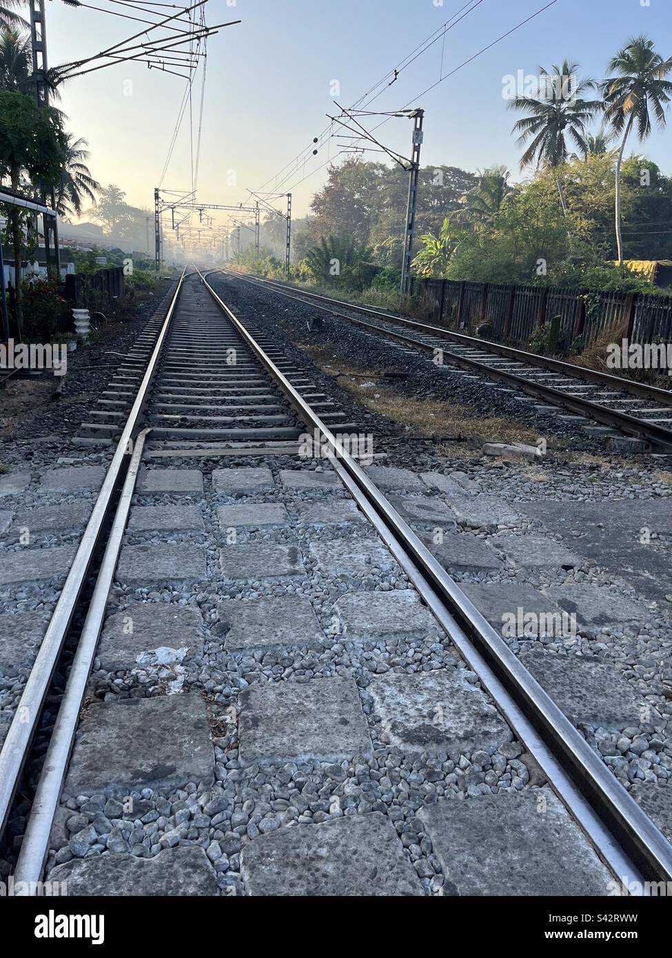 Railway line early in the morning in Kerala Stock Photo Alamy