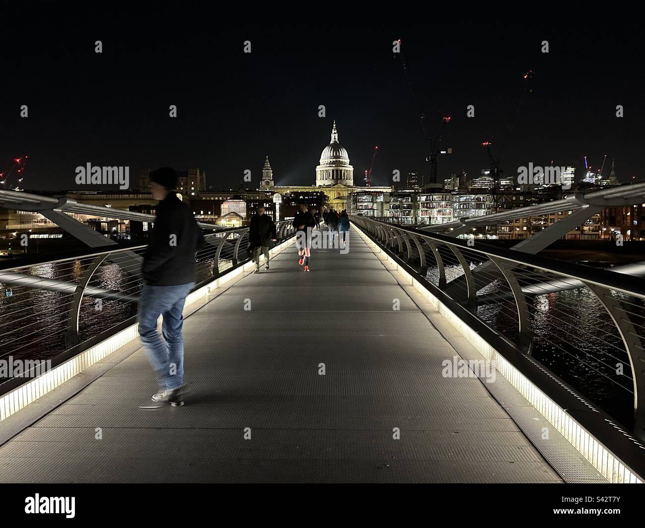 The London Millennium Bridge at night with St Pauls Cathedral in the distance - Smartphone Captured Stock Image