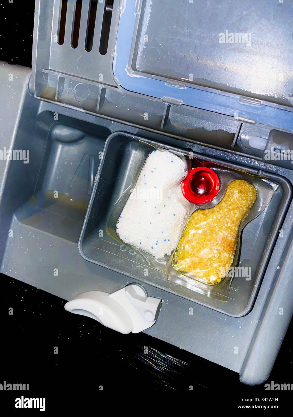 Dishwasher detergent compartment with soap pod inside dispenser Stock