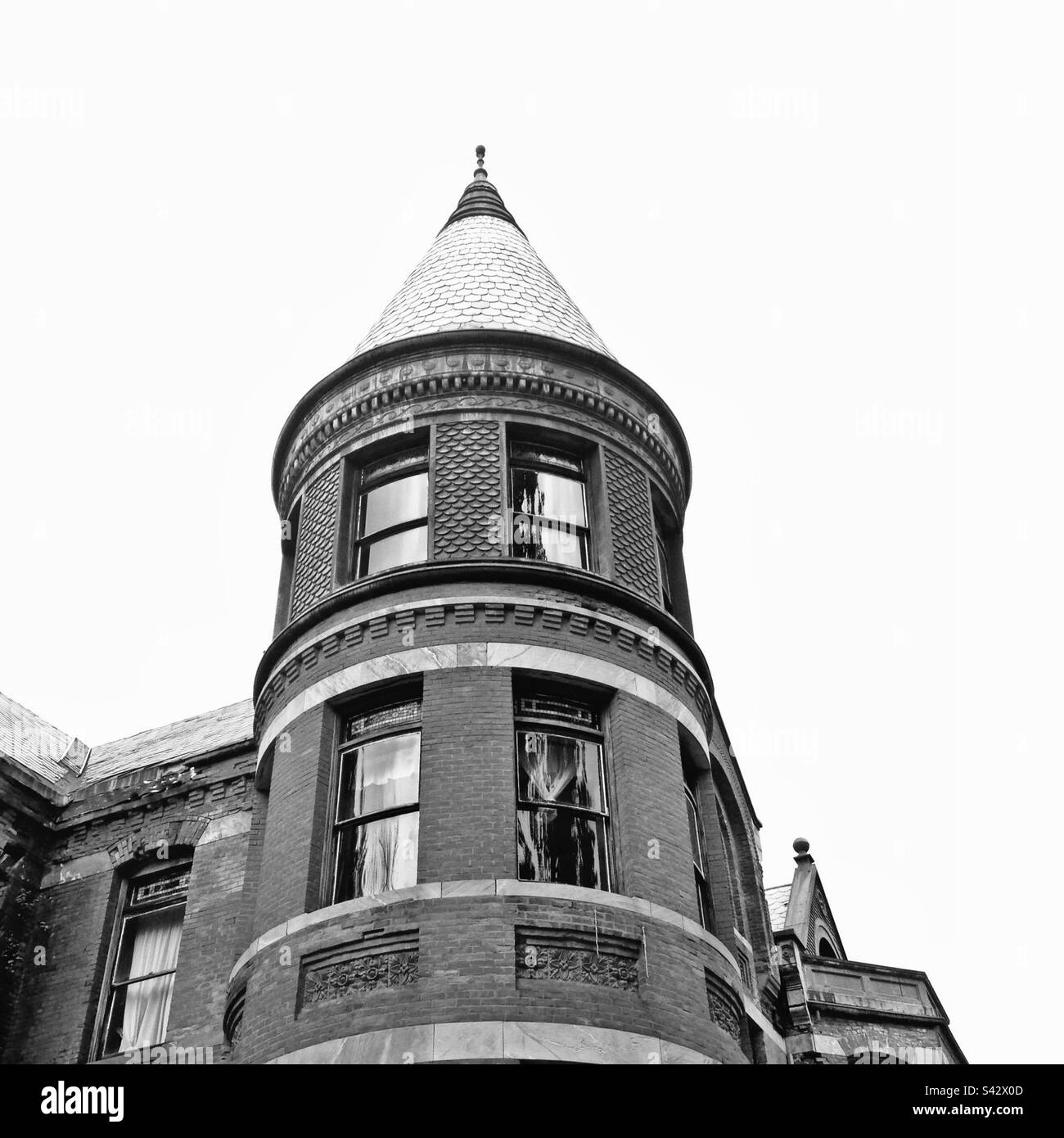 Black and white of Wilson Castle tower in Proctor, Vermont, USA. Turret with brick architecture. Empty space for copy. - Smartphone Captured Stock Image