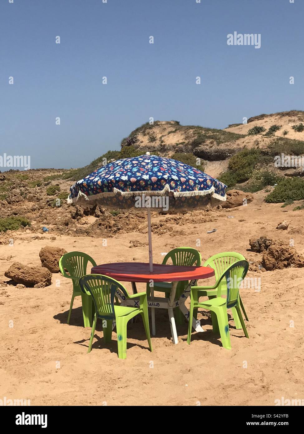 Picnic on the beach with Monobloc Stock Photo