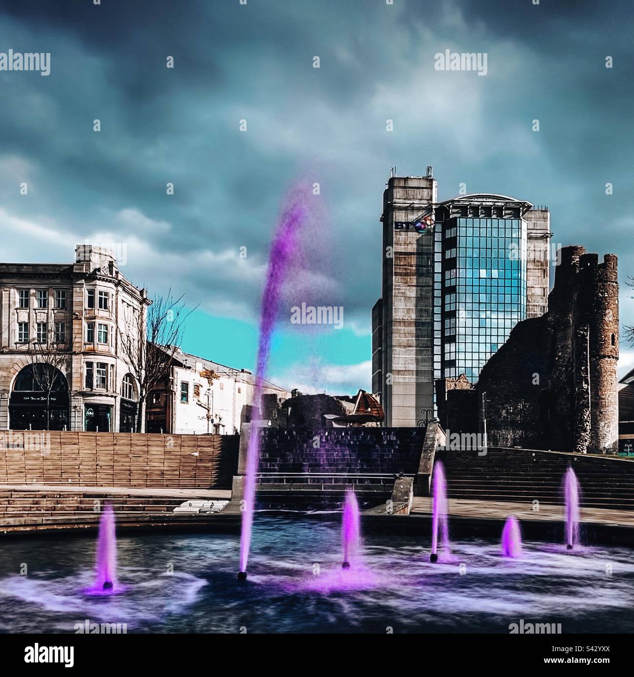 Swansea fountain with purple water in Castle square. - Smartphone Captured Stock Image