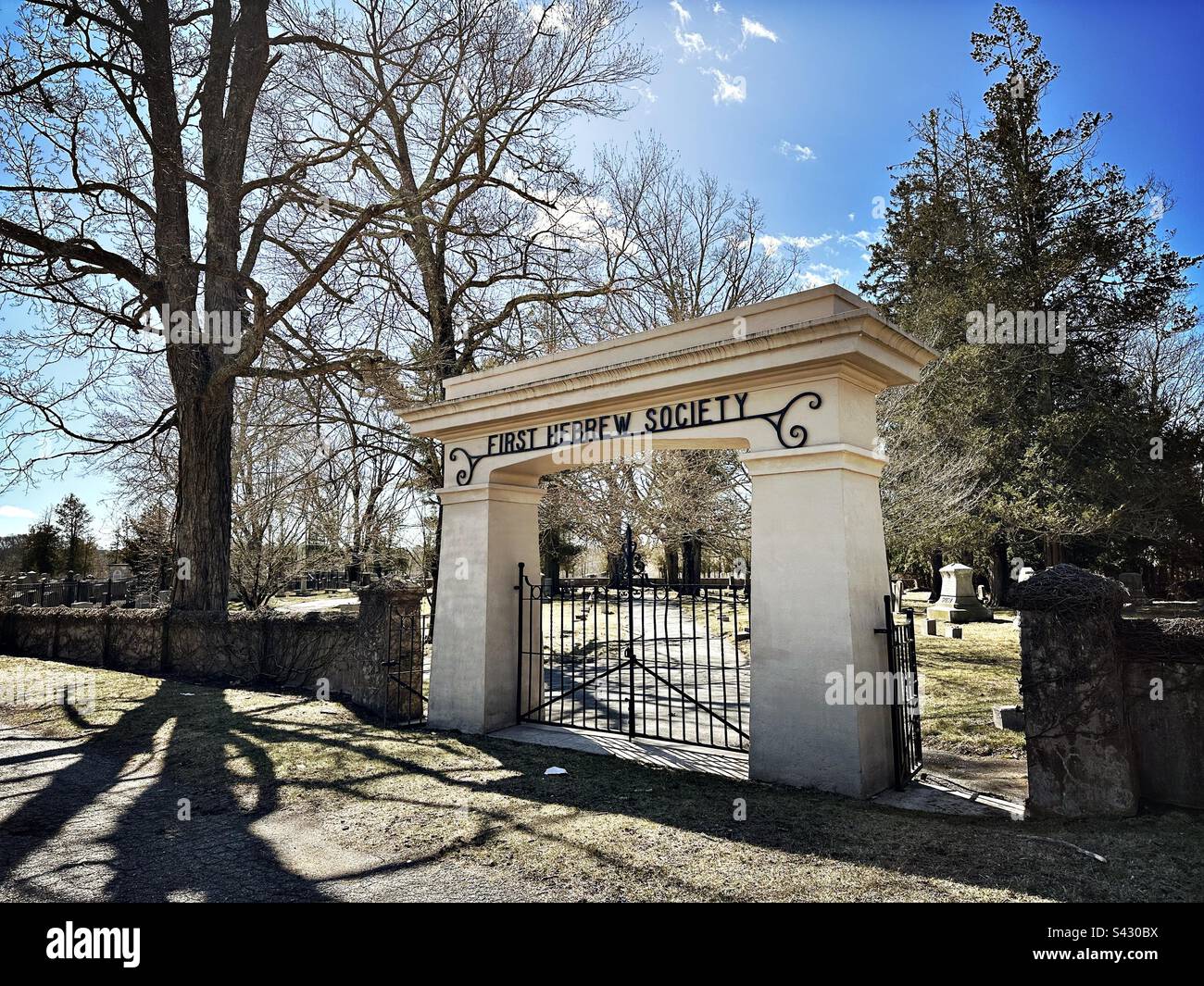 Entrance gate to Jewish cemetery in Preston, Connecticut, USA. Called First Hebrew Society. Taken during early spring. - Smartphone Captured Stock Image