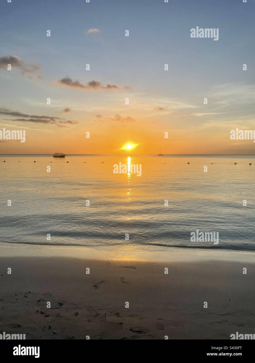 Sunset from the beach in Negril, Jamaica. Stock Photo