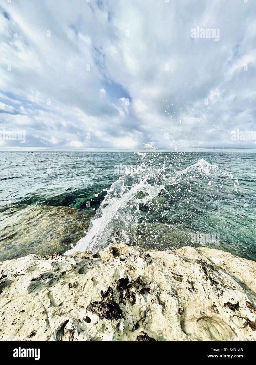 Seascape with a splash. Mediterranean shores in the south of France - Smartphone Captured Stock Image