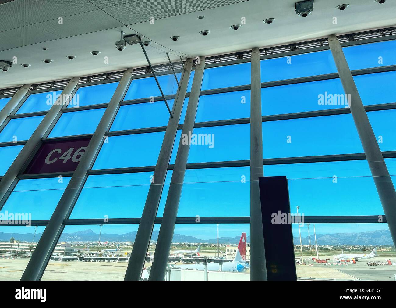 View from the terminal building at Palma, Mallorca, Spainish island. Swiss plane and aircraft movements - Smartphone Captured Stock Image
