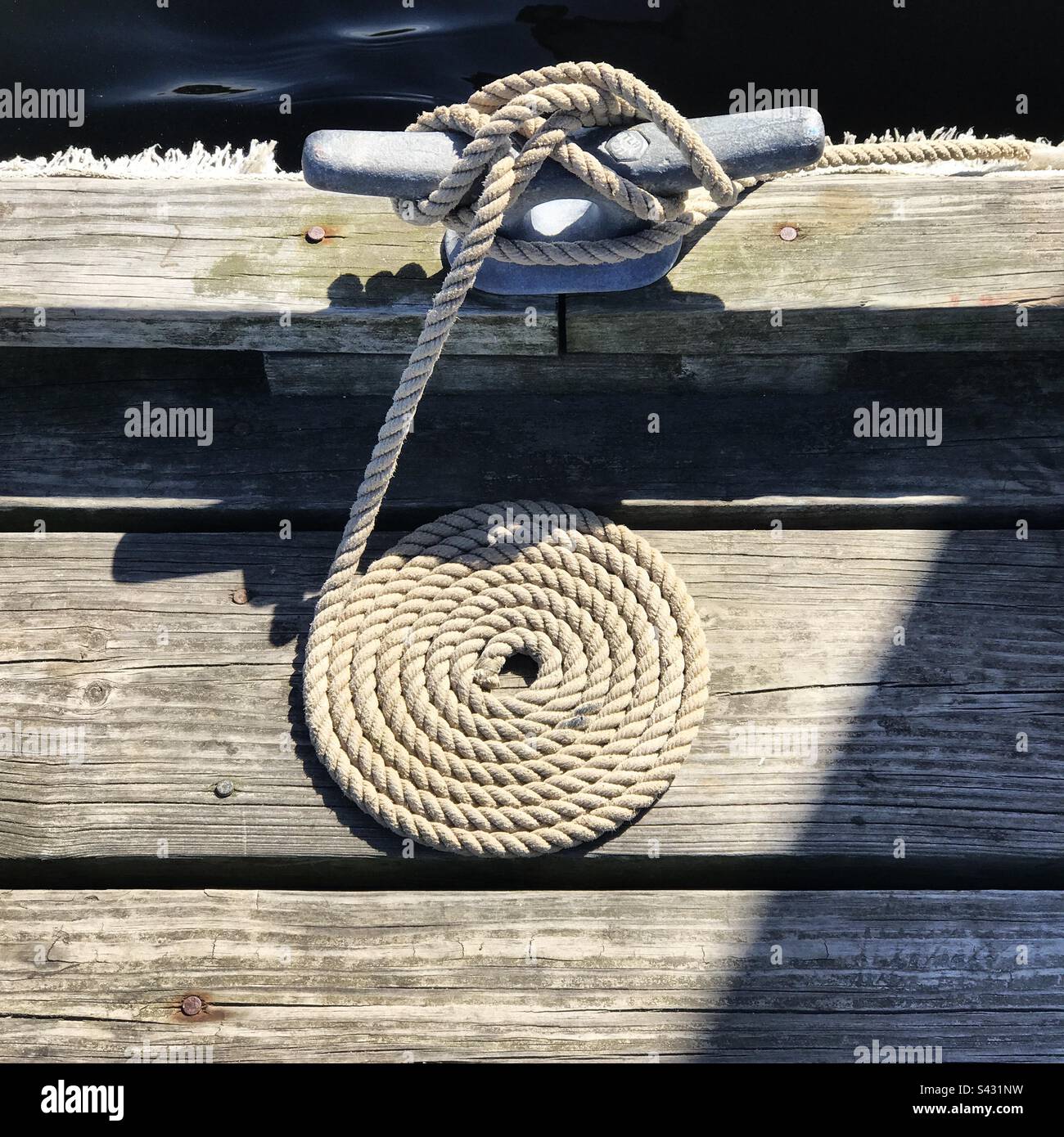 Coiled rope on dock hi-res stock photography and images - Alamy