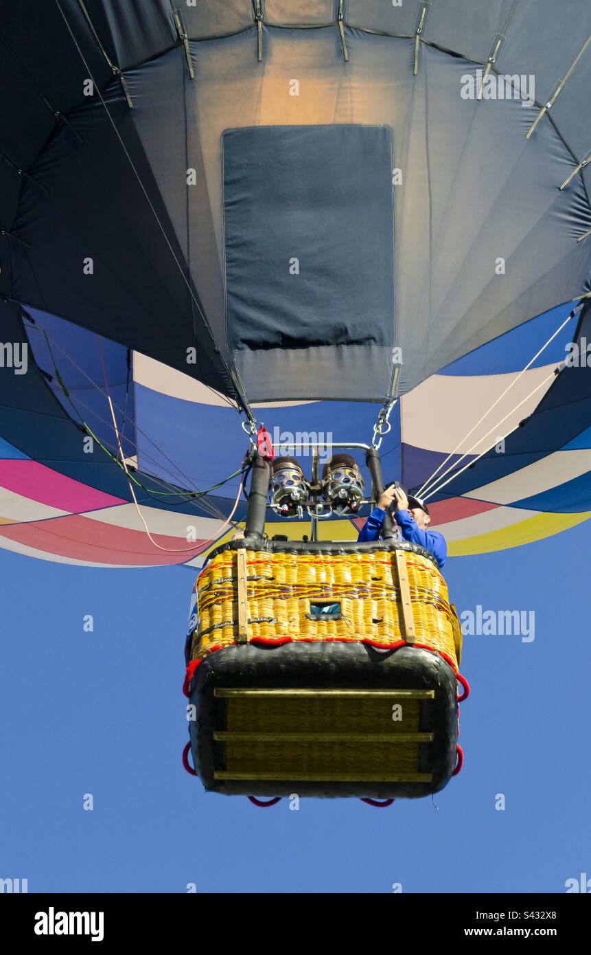 Hot air balloon pilot flying overhead Stock Photo Alamy