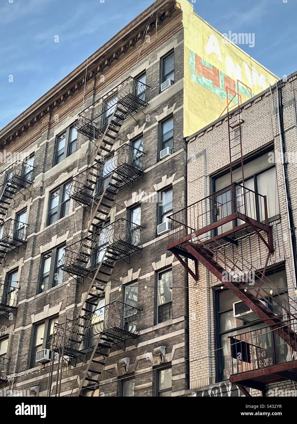 New York stone building with outdoor iron stairs in the little iltaly