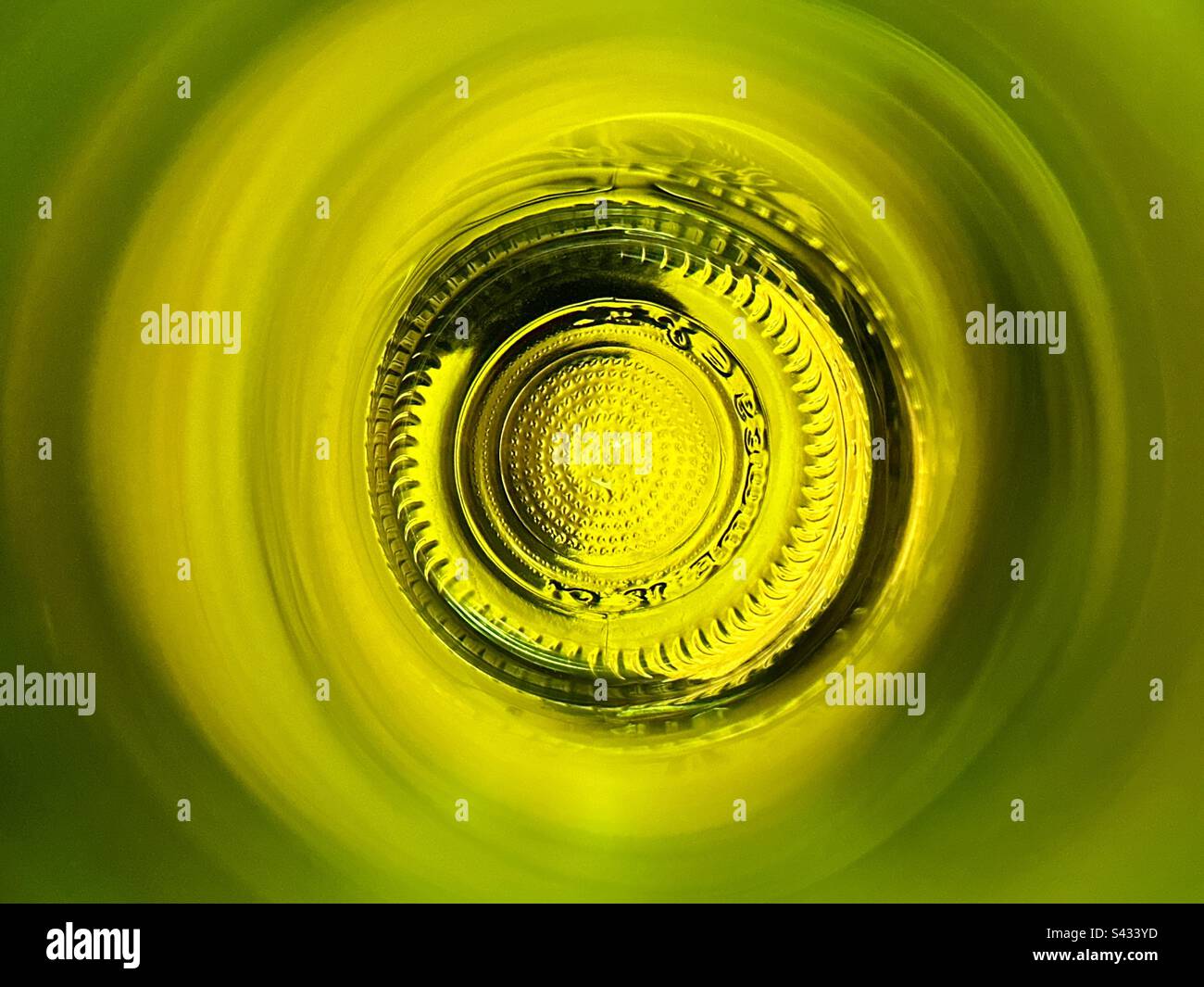 Bottom of a wine bottle seen through the neck of the bottle. Abstract. - Smartphone Captured Stock Image