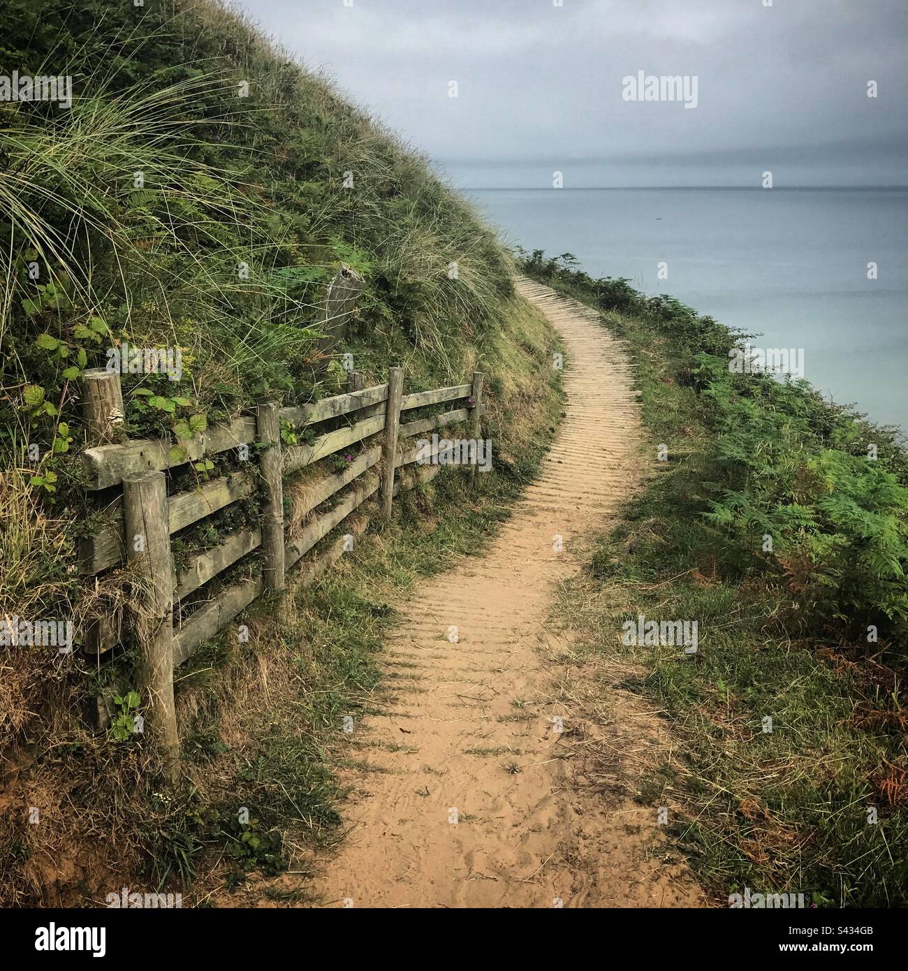 The beautiful Gower Coast Path is a mecca for hikers at Llangennith near Rhossili in the Gower area of West Wales - Smartphone Captured Stock Image