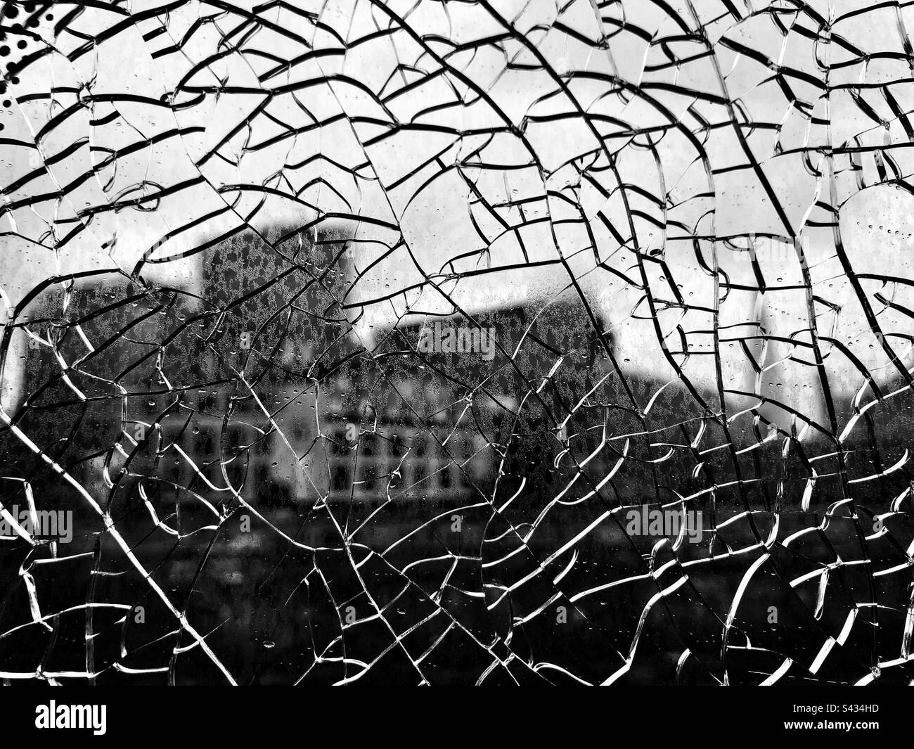 Buildings behind shattered glass Stock Photo