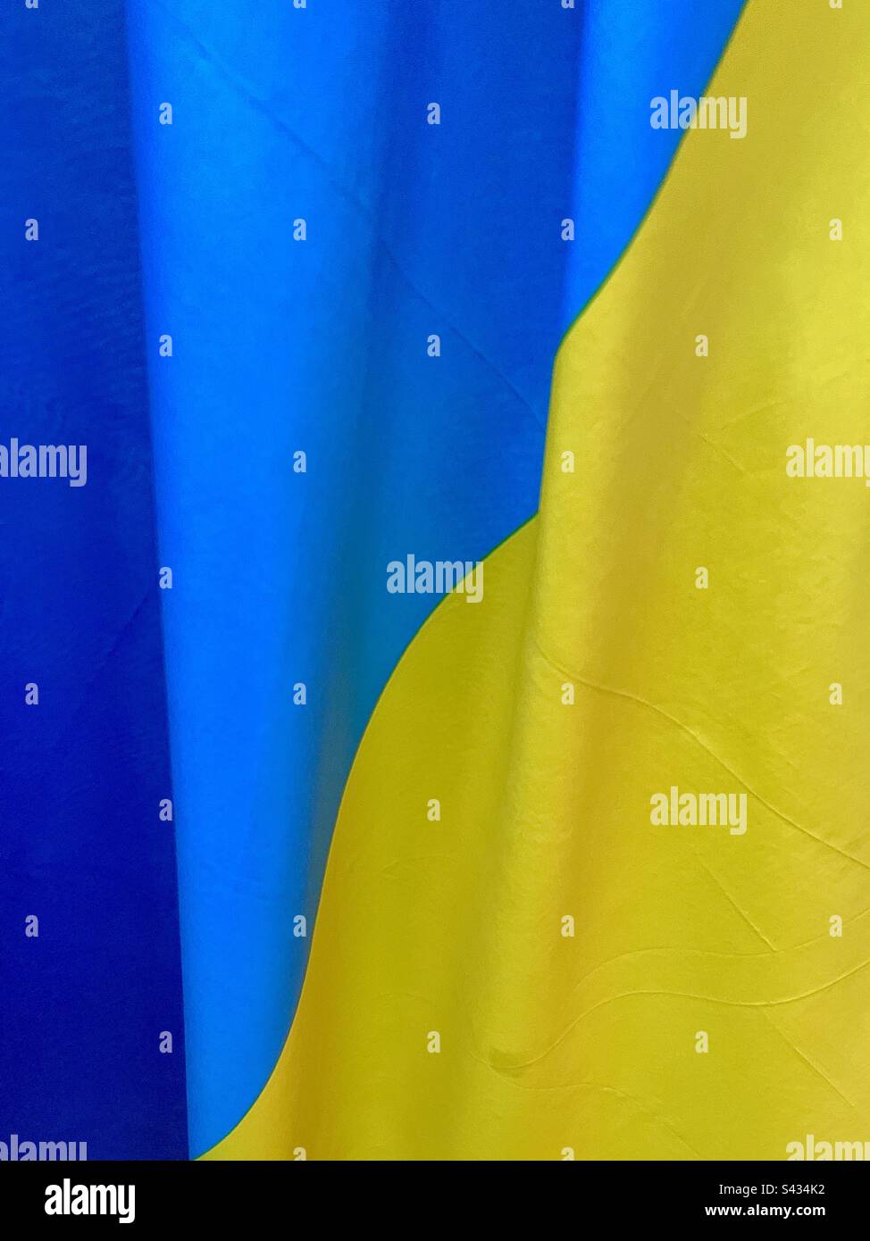 Yellow and blue draped fabric background - Smartphone Captured Stock Image