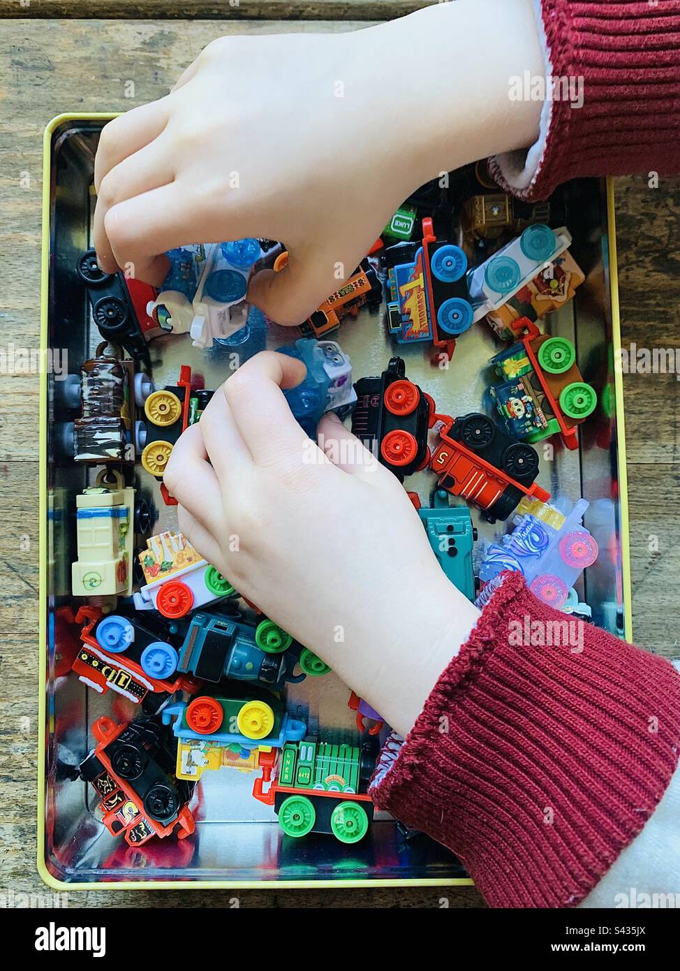 Child playing with Thomas and Friends Minis Trains - Smartphone Captured Stock Image