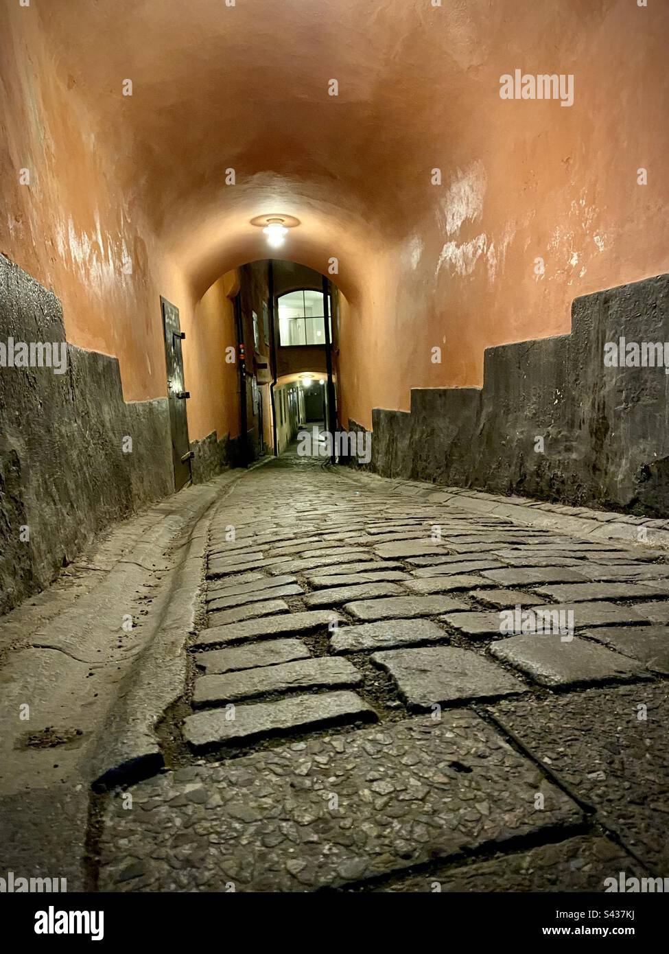 Night time on the beautiful but spooky narrow cobbled streets of Stockholm Old Town Gamla Stan in Sweden - Smartphone Captured Stock Image