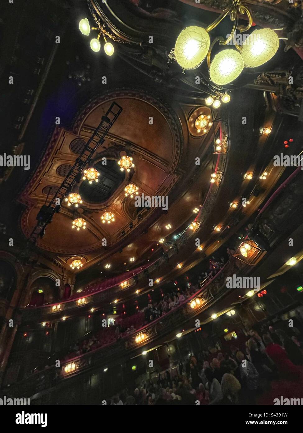 Circle seats at the London Palladium auditorium and ceiling with lights up - Smartphone Captured Stock Image