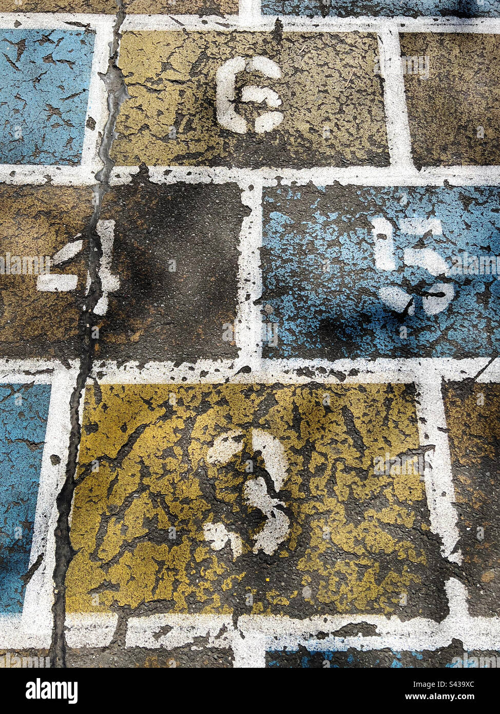 Numbers 3,4,5,6 on an old painted hopscotch game in a playground in New York City, USA. - Smartphone Captured Stock Image
