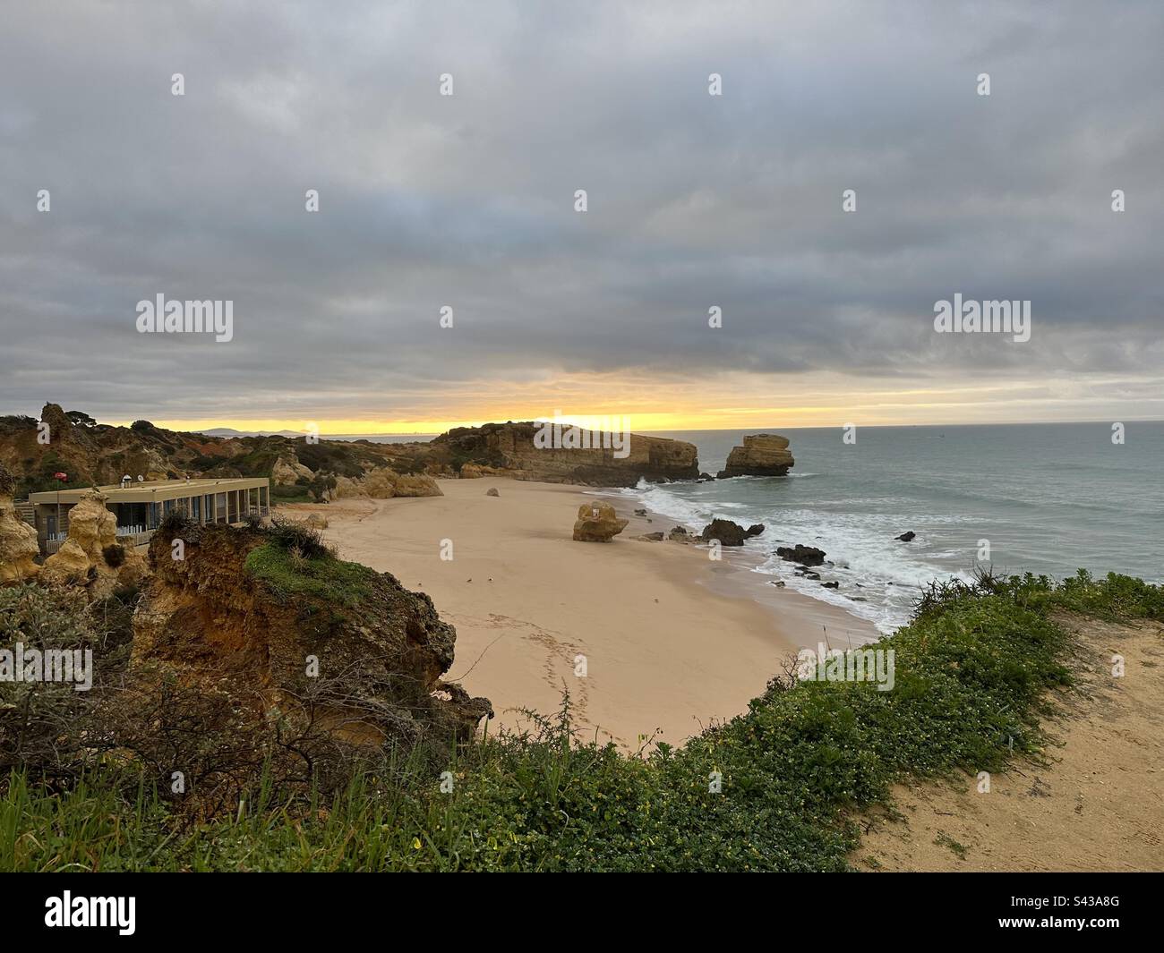 So Rafael Waiting for sunrise from the clifftops of Praia de São Rafael, Portugal ...