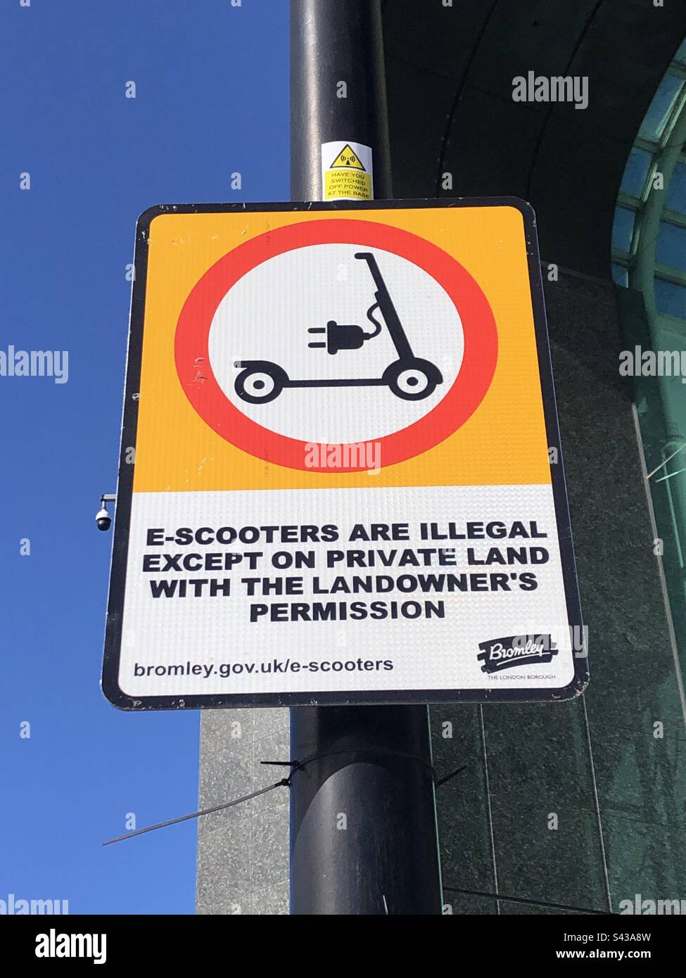 Warning sign saying use of escooters are illegal in England Stock Photo Alamy