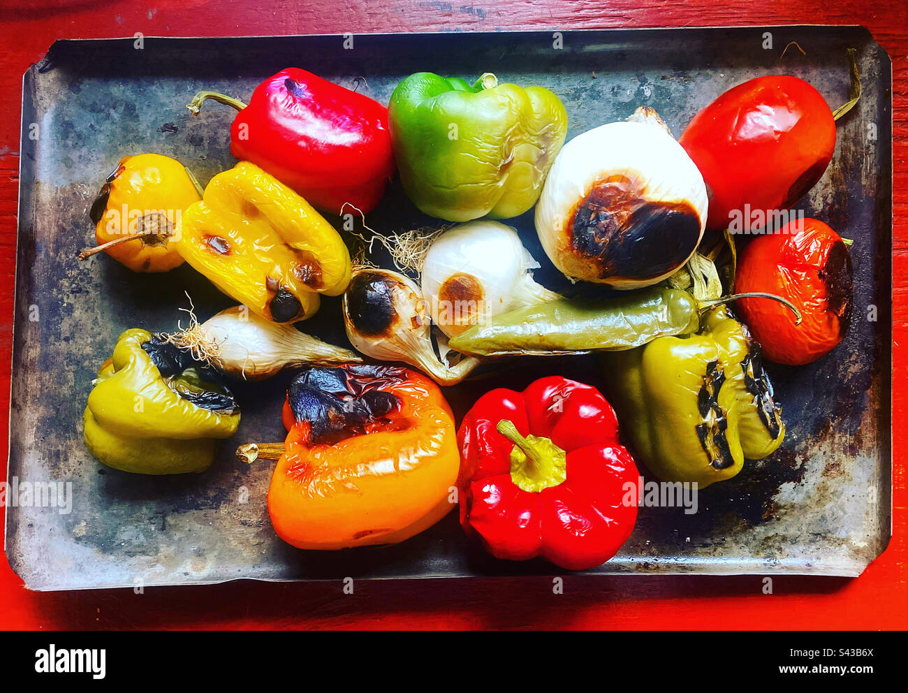 Green, yellow and red sweet peppers, tomatoes, onions a green hot chilli pepper and a manzano spicy chilli pepper in Queretaro, Mexico Stock Photo