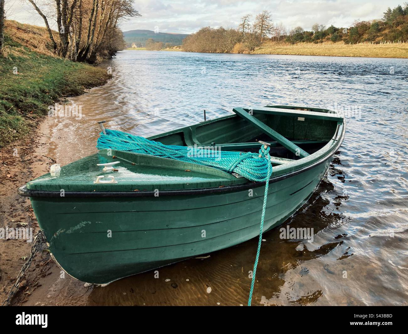 A green trout Fishing boat on the River Spey, Grantown-on-Spey, Scotland - Smartphone Captured Stock Image