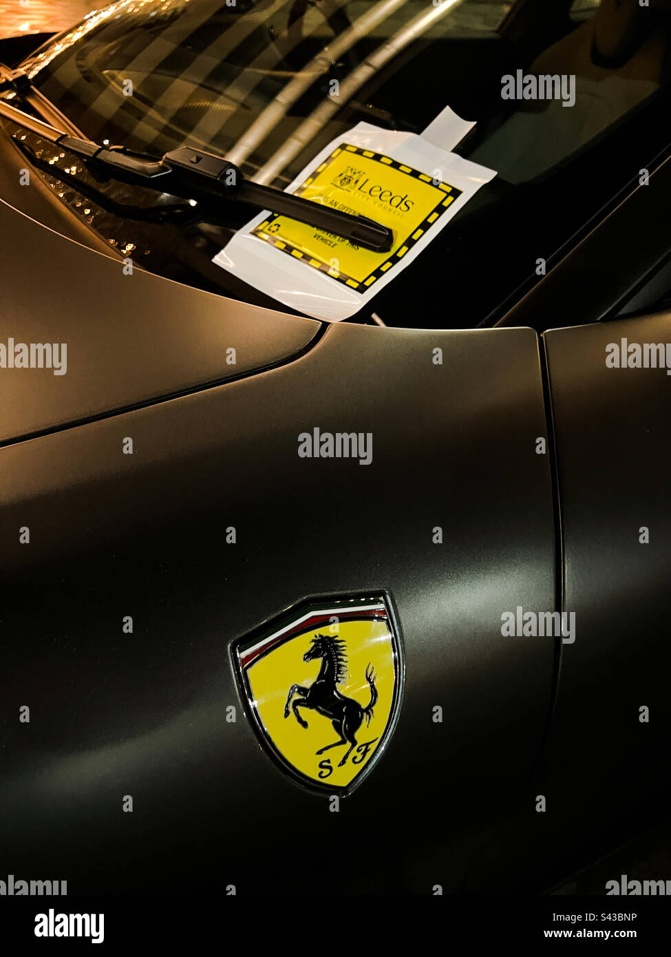 Ferrari with a parking ticket - Smartphone Captured Stock Image