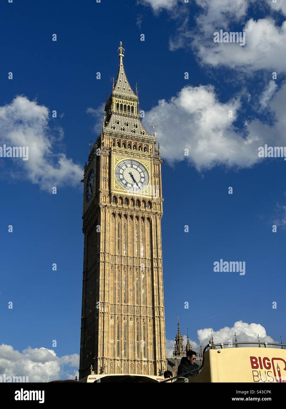 Big Ben and open top Big Bus with women tourists sightseeing, London, England Stock Photo