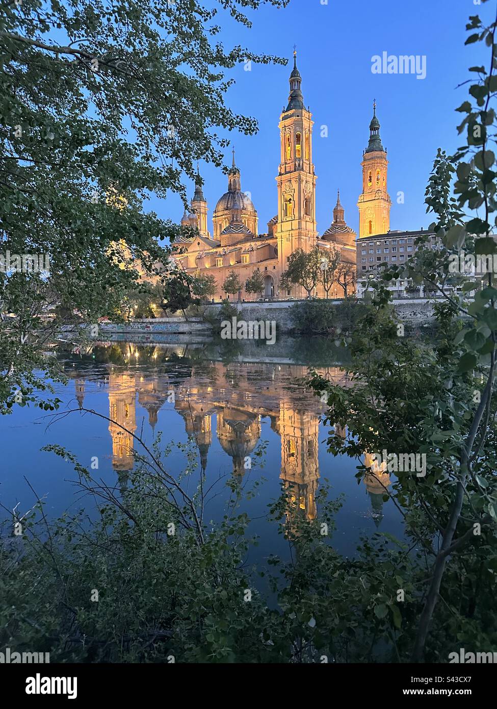 Cathedral-Basilica of Our Lady of the Pillar, Zaragoza, and its reflection on Ebro river. Basílica de Nuestra Señora del Pilar, Zaragoza, con reflejo en el rio Ebro Stock Photo