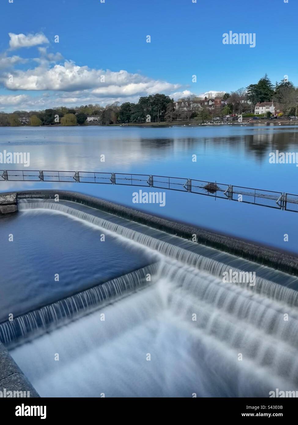 Roath park with the overflow weir for Roath Brook, Cardiff, South Wales. - Smartphone Captured Stock Image