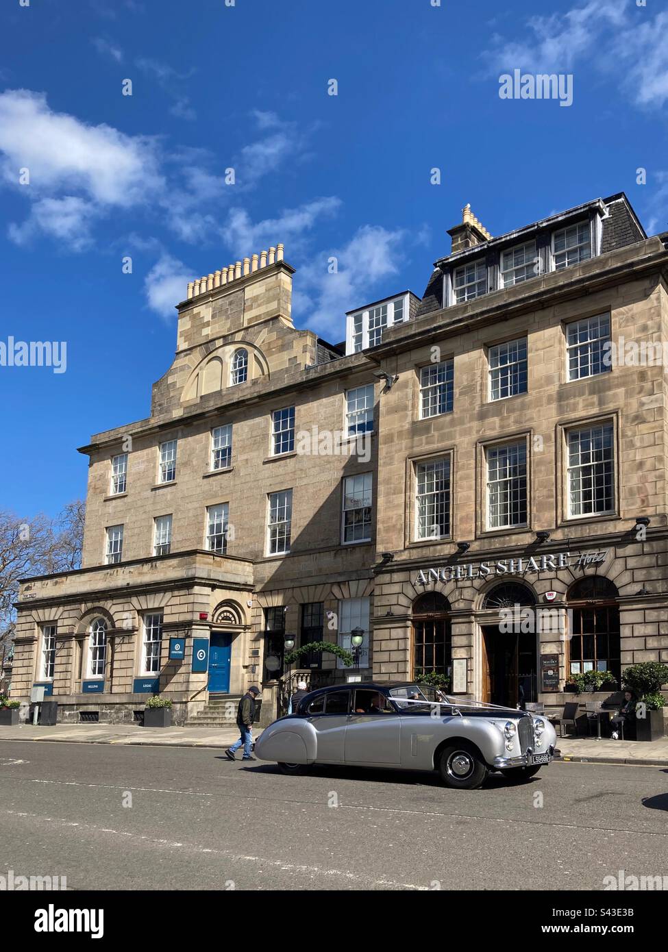 1954 Classic Jaguar Mark 7 in silver repurposed as a chauffeur-driven limousine wedding car, in Hope Street Edinburgh West End, Scotland - Smartphone Captured Stock Image