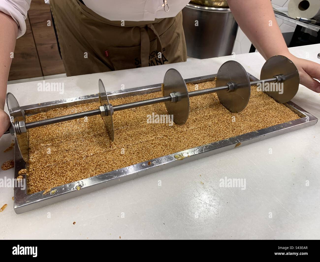 Making sesame snaps in Seville - Smartphone Captured Stock Image