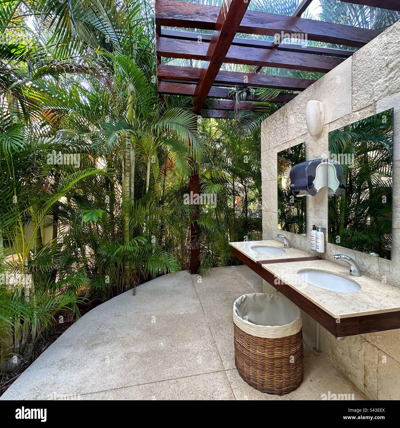 Tropical greenery provides the decor at a restroom near the beach