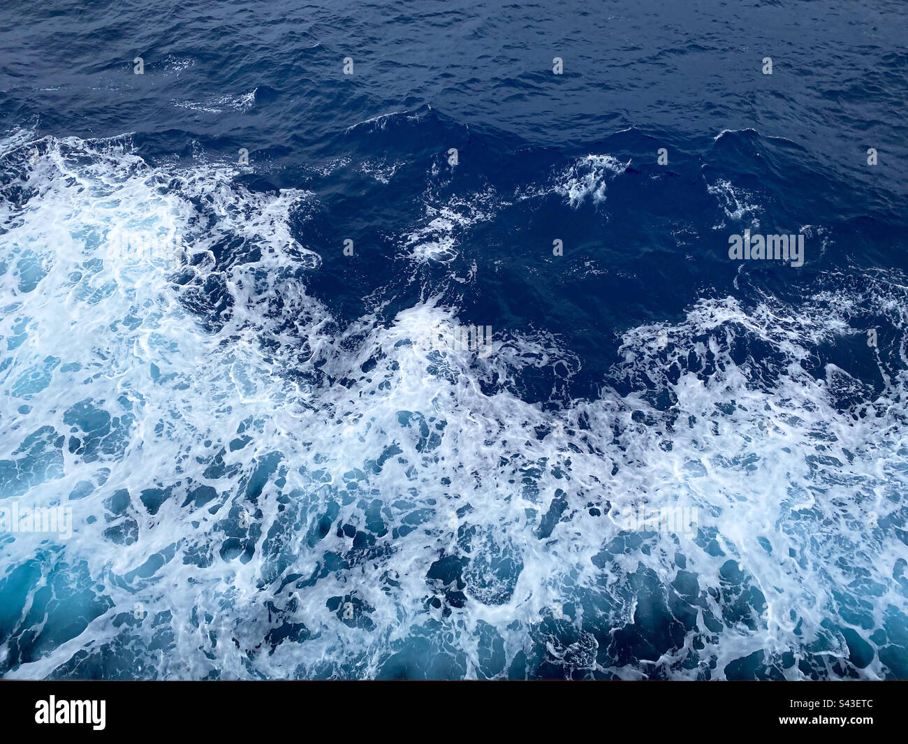 Water disturbed from the movement of a ship. - Smartphone Captured Stock Image