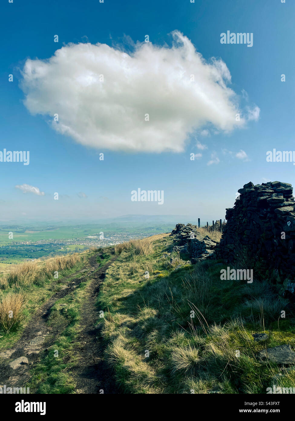 Wandering as lonely as a cloud at Weets hill a great hiking route in Barnoldswick Lancashire - Smartphone Captured Stock Image