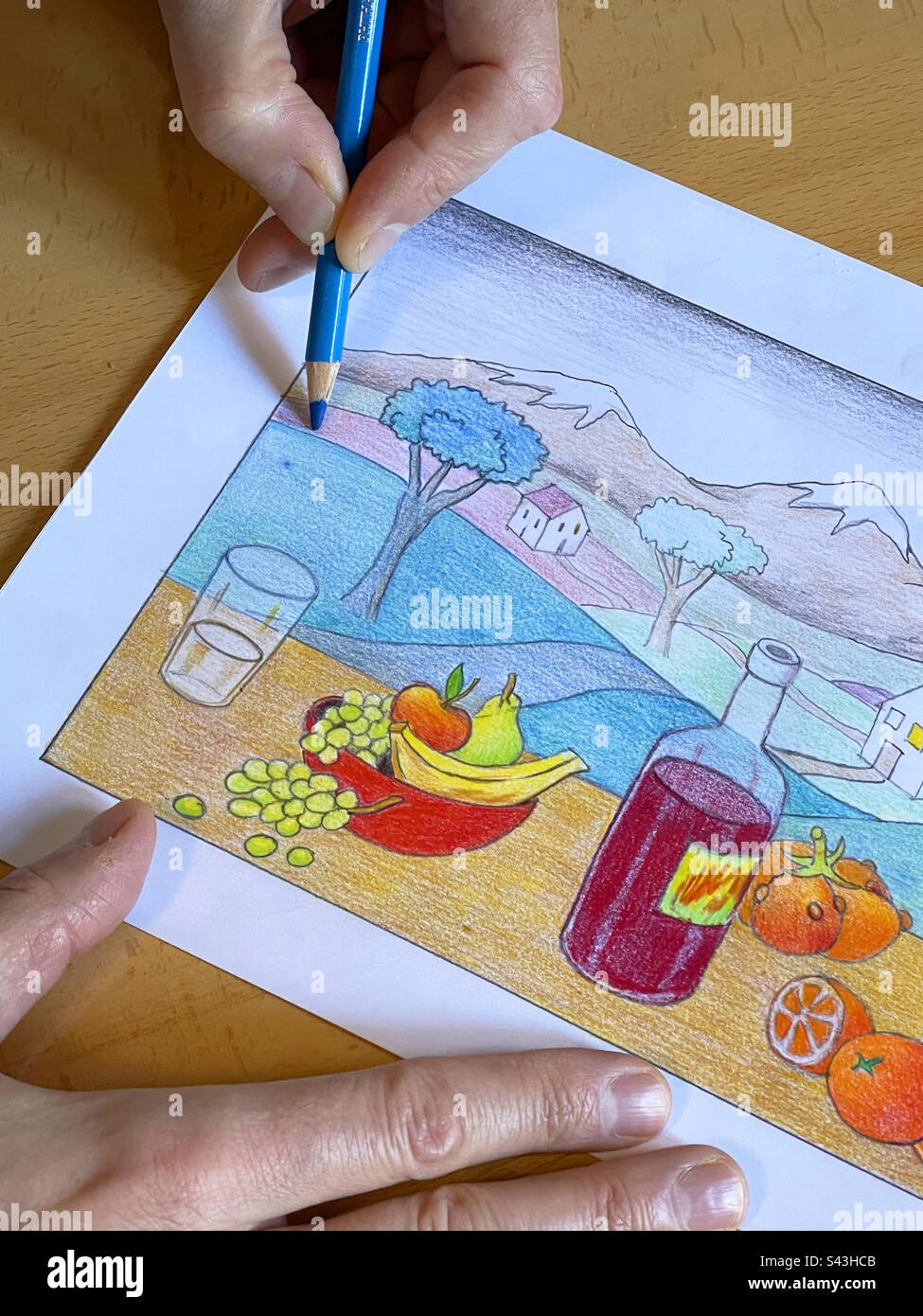 Hands colouring and  illustration with color pencils. Stock Photo