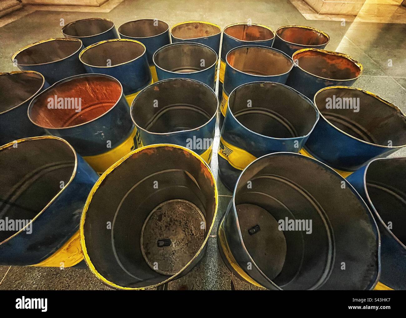 The Third Choir, Lydia Ourahmane, aerial perspective showing the mobile phones tuned to FM inside the oil barrels. The barrels have come from Algeria; a route of migration. Tate Britain, London - Smartphone Captured Stock Image