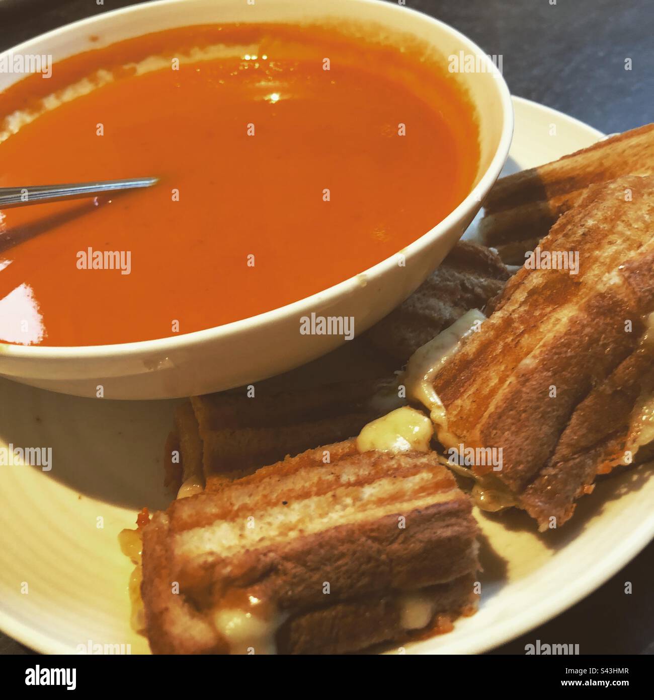 Tomato soup with cheesy toast Stock Photo