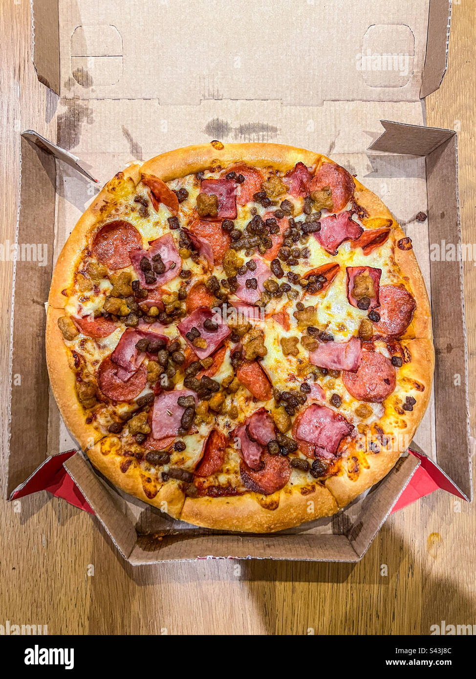 Meat feast pizza in box Stock Photo Alamy