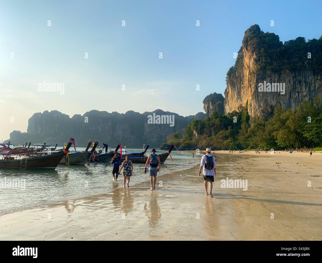Railay Beach, Thailand - March 11, 2023: Tourists boarding longtail taxis boats - Smartphone Captured Stock Image