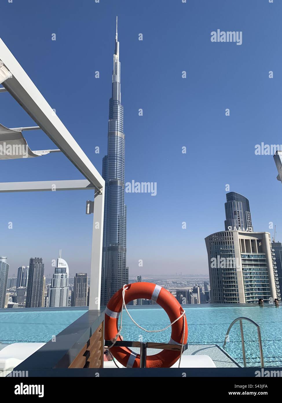 Dubai, United Arab Emirates - April 21, 2023: View of the Burj Khalifa and surrounding buildings from the pool deck of Cé La Vi - Smartphone Captured Stock Image