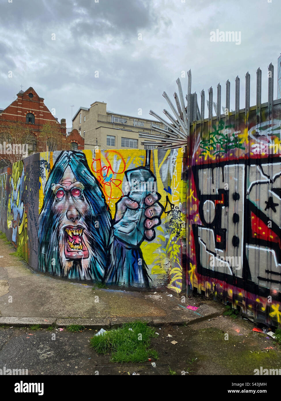 Graffiti? Street Art? Interesting? Rubbish? You decide. A street scene somewhere in Europe. Photo ©️ COLIN HOSKINS. - Smartphone Captured Stock Image