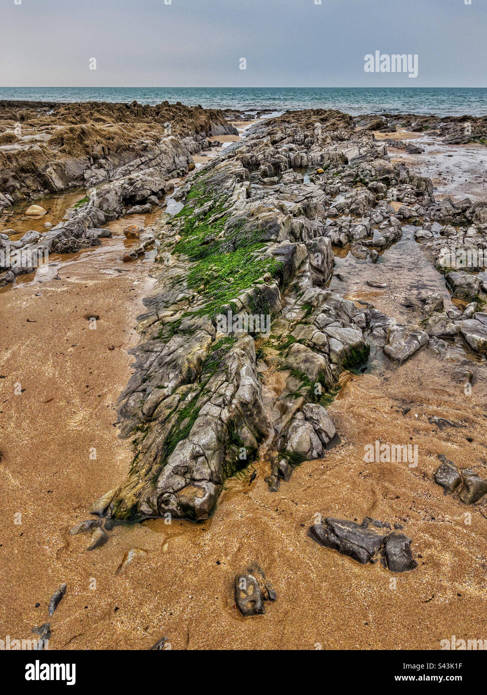 Rocky beach, with sea and horizon in the distance - Smartphone Captured Stock Image