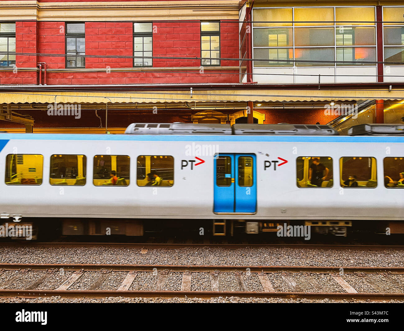 Train arriving at platform in Flinders Street Station in Melbourne, Victoria, Australia. - Smartphone Captured Stock Image