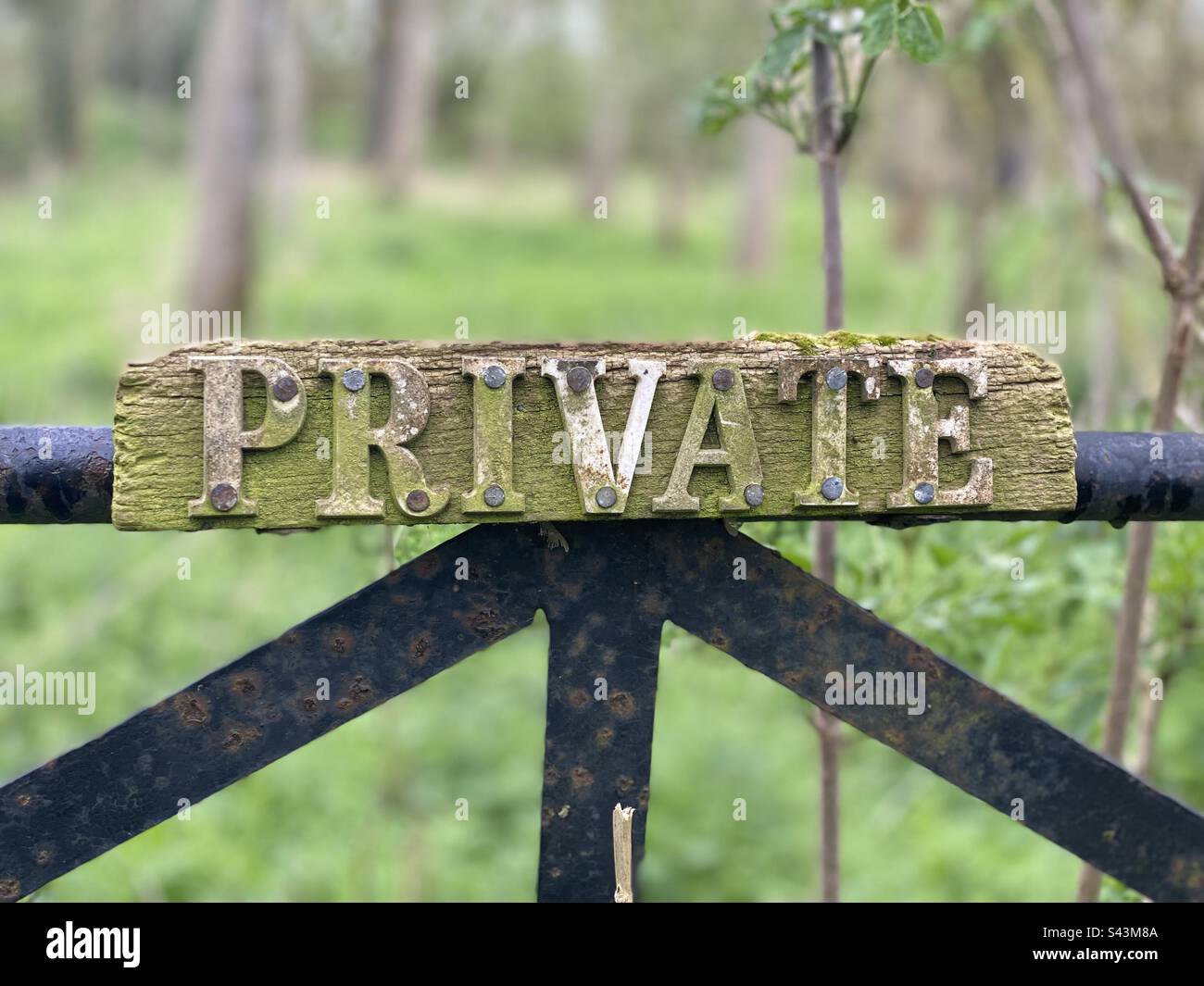 ‘PRIVATE’ sign on old gate in countryside Stock Photo