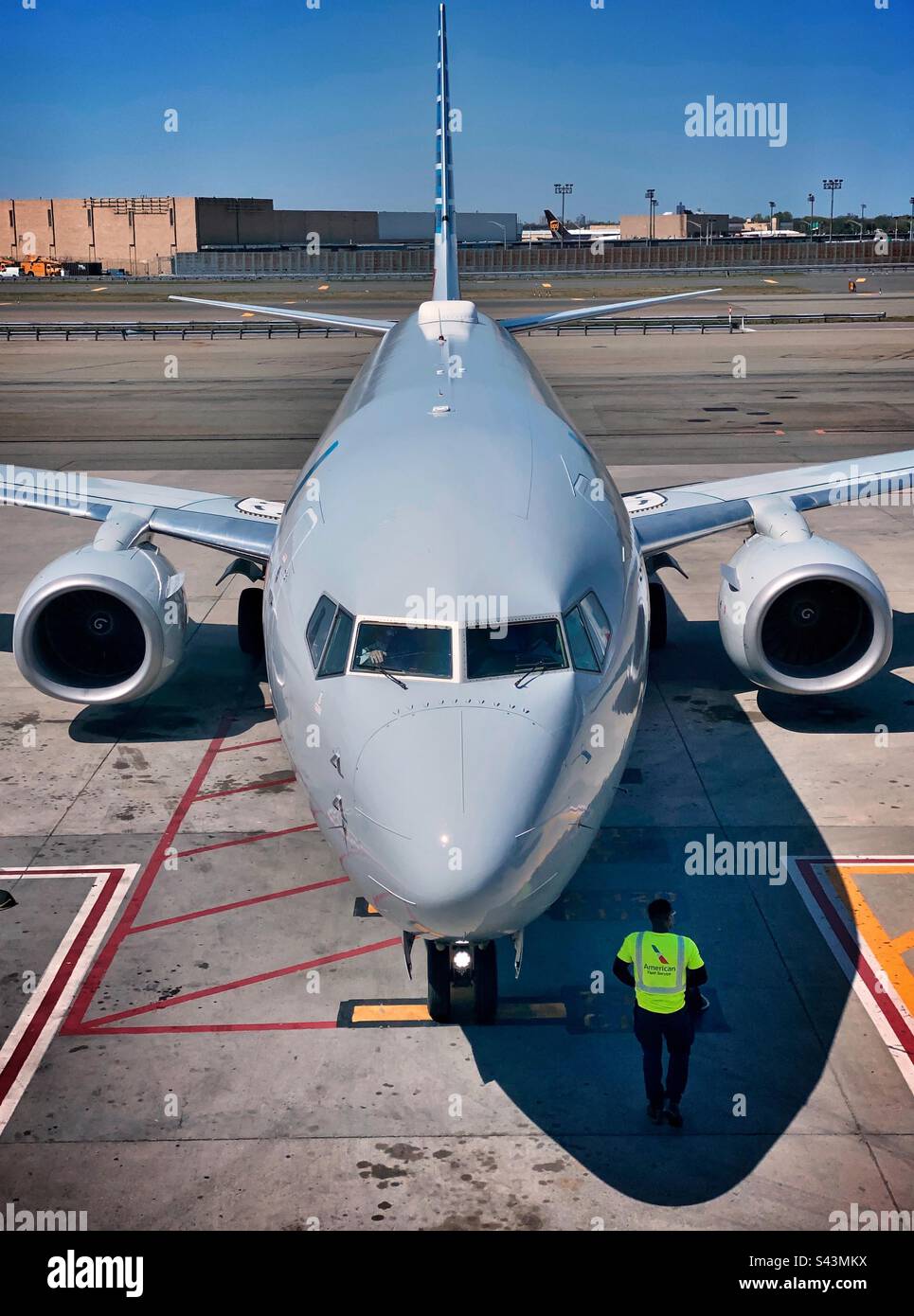 A plane arrives at terminal 8 JFK John F Kennedy airport in New York